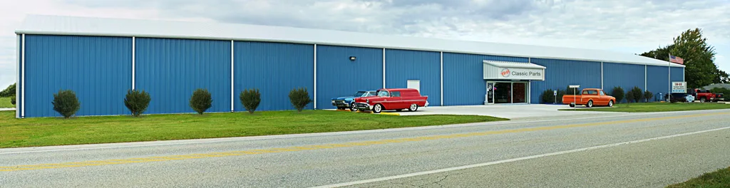 H&H Classic Parts storefront in Bentonville, AR — classic Chevy and GMC vehicles outside